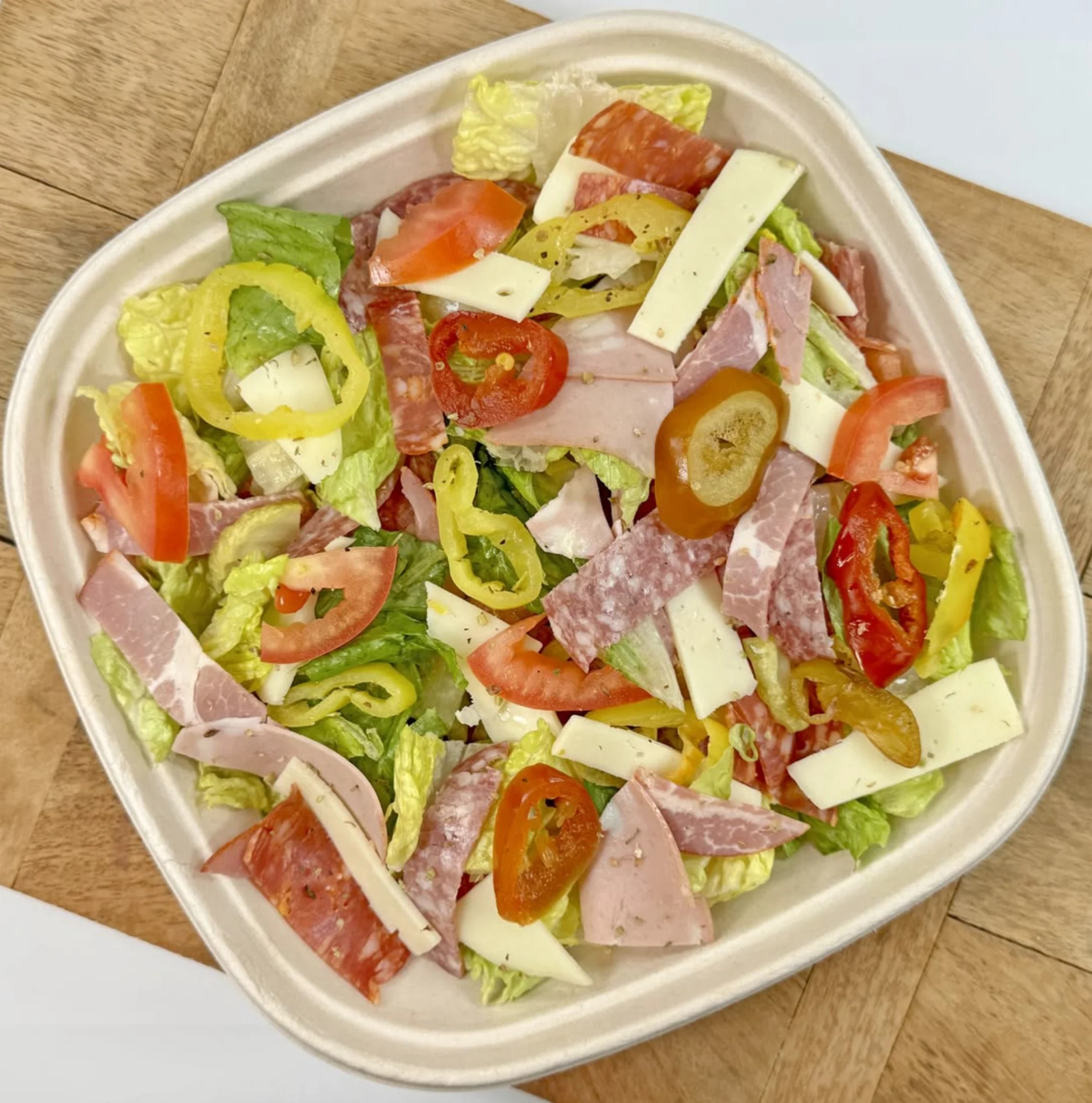 Antipasto platter with cured meats, cheeses, and olives
